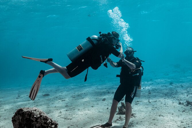 Baptism diving in the turquoise waters of Tahiti - Tahiti’s first scuba lesson is built for beginners, not show-offs