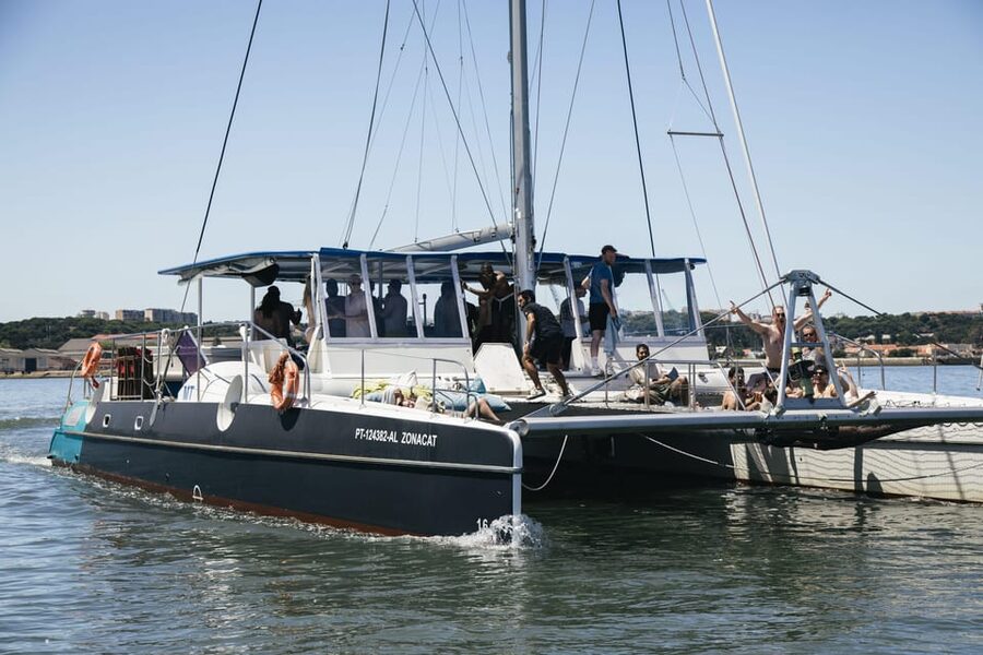 Lisbon: Catamaran Boat Party with Music, Open Bar & Dives - Where to meet: Doca de Santo Amaro, door 3 (and the Rui dos Pregos trick)