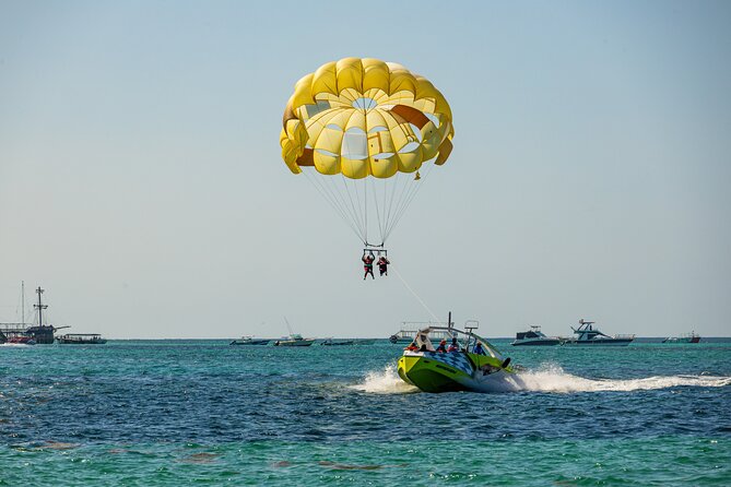 PACKAGE DEAL Catamaran- Snorkeling - Hooka Diving - Parasailing - Open Bar and Party Cruise Reality: Fun Energy With a Few Caveats